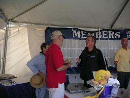 USUA Executive Vice President, Dale Hooper, talking to visitors at the USUA tent. (Click on image to view full size photo)